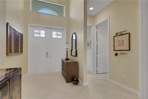 a view of an entryway with wooden floor