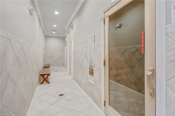 a hallway with sliding door and couch
