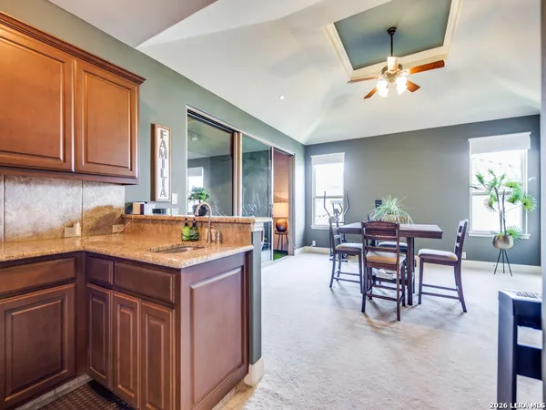 a kitchen with a sink cabinets and window