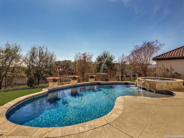 a view of a swimming pool with outdoor seating