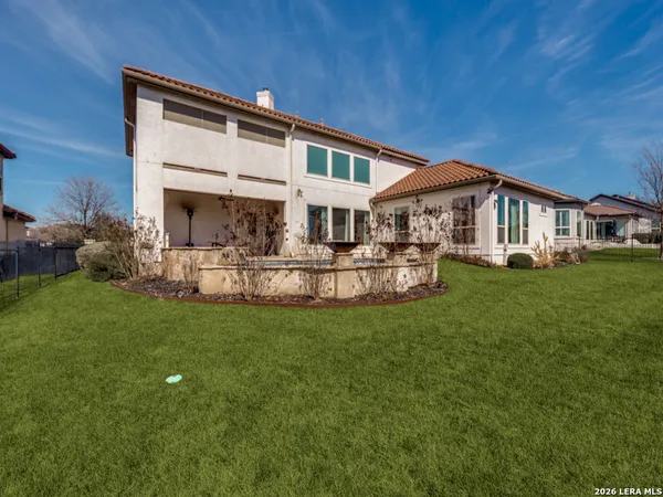 a front view of a house with a yard table and chairs