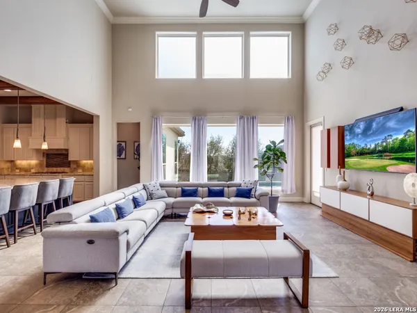 a living room with furniture and a large window