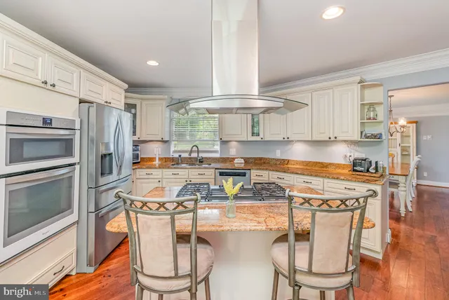 a bathroom with a sink toilet and a window