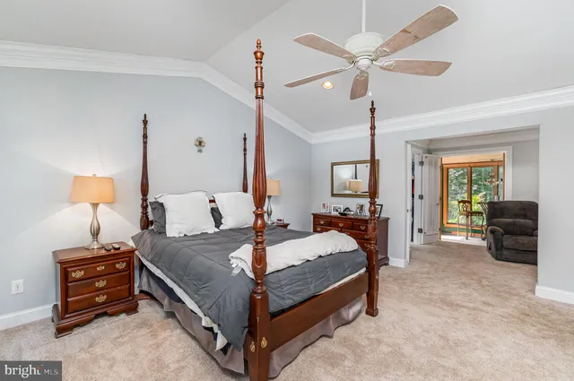 a living room with furniture and a mirror