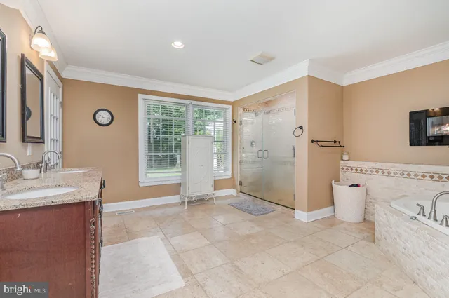 a view of a chairs and table in the back yard of the building