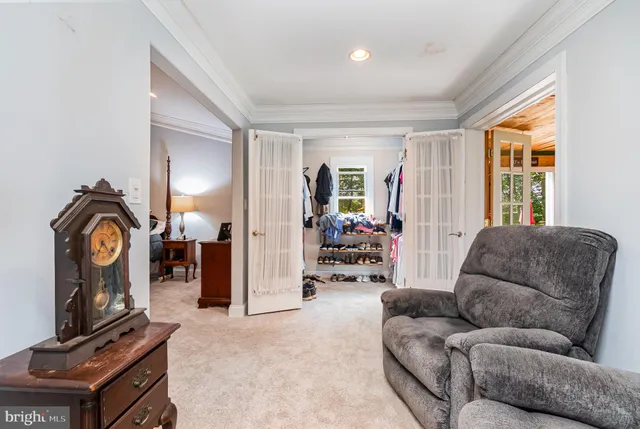 a bedroom with a bed and ceiling fan
