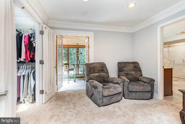 a bedroom with a bed and a tv