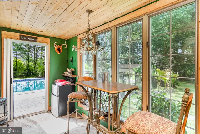 a view of a chair and tables front of the house