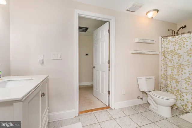 a view of a patio with table and chairs and potted plants