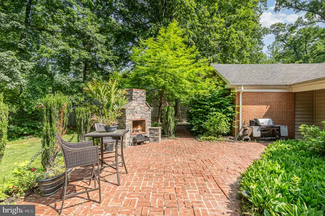 an aerial view of a house with a yard and garden