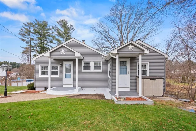a front view of a house with a yard