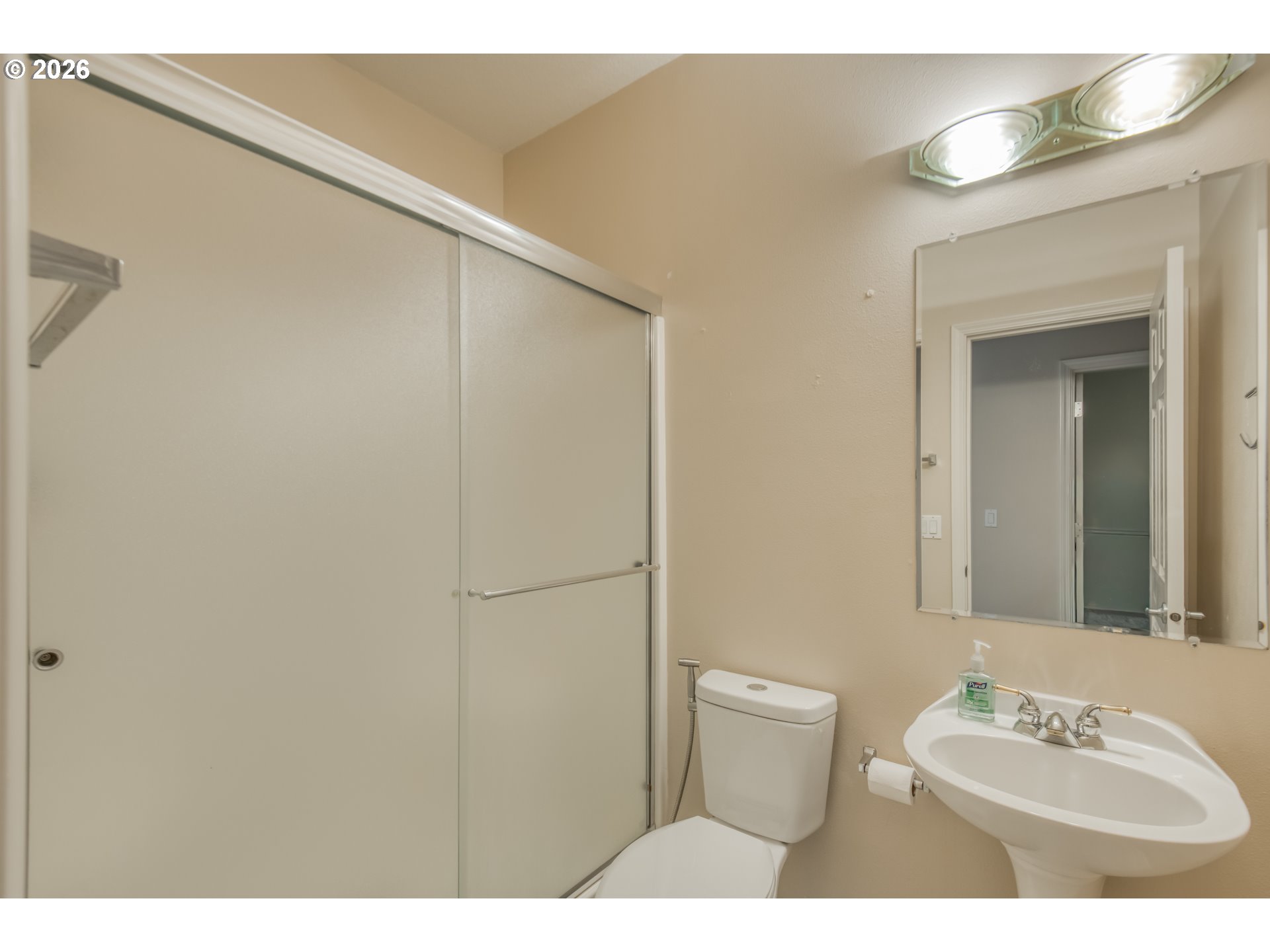 3637 Northwest Lansbrook Terrace Portland, OR 97229 - Photo 17 of 43 a bathroom with a sink mirror vanity and toilet
