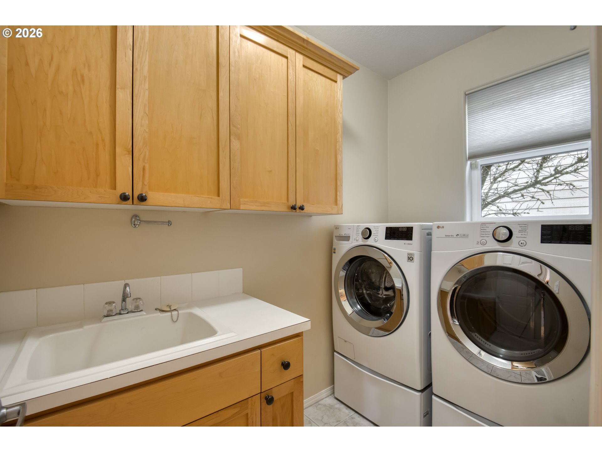 3637 Northwest Lansbrook Terrace Portland, OR 97229 - Photo 18 of 43 a utility room with dryer and washer