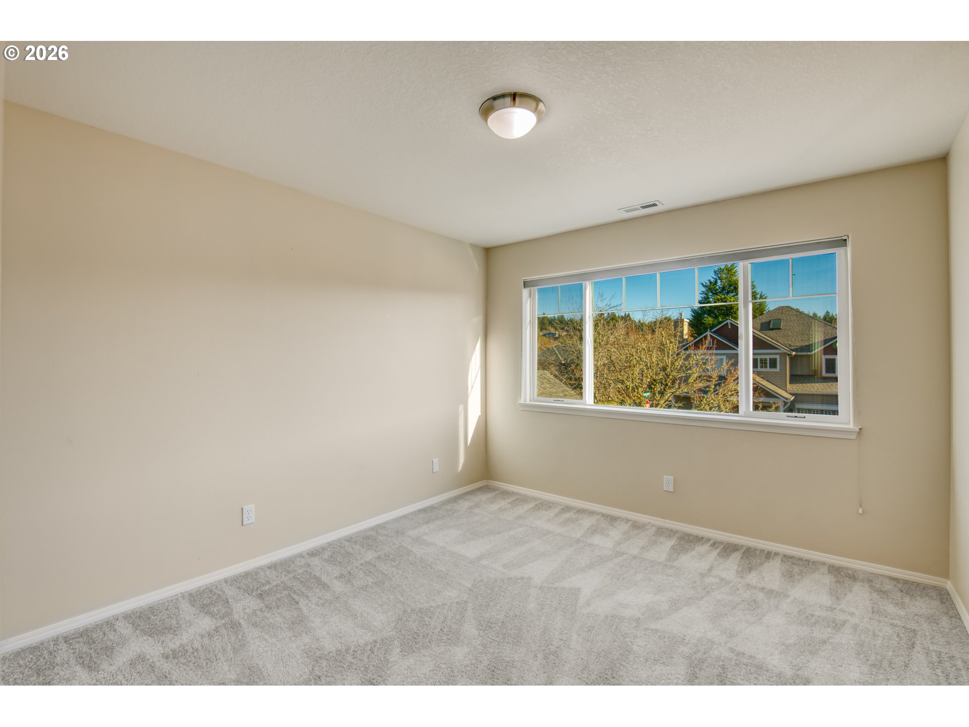 3637 Northwest Lansbrook Terrace Portland, OR 97229 - Photo 19 of 43 a view of an empty room with a window