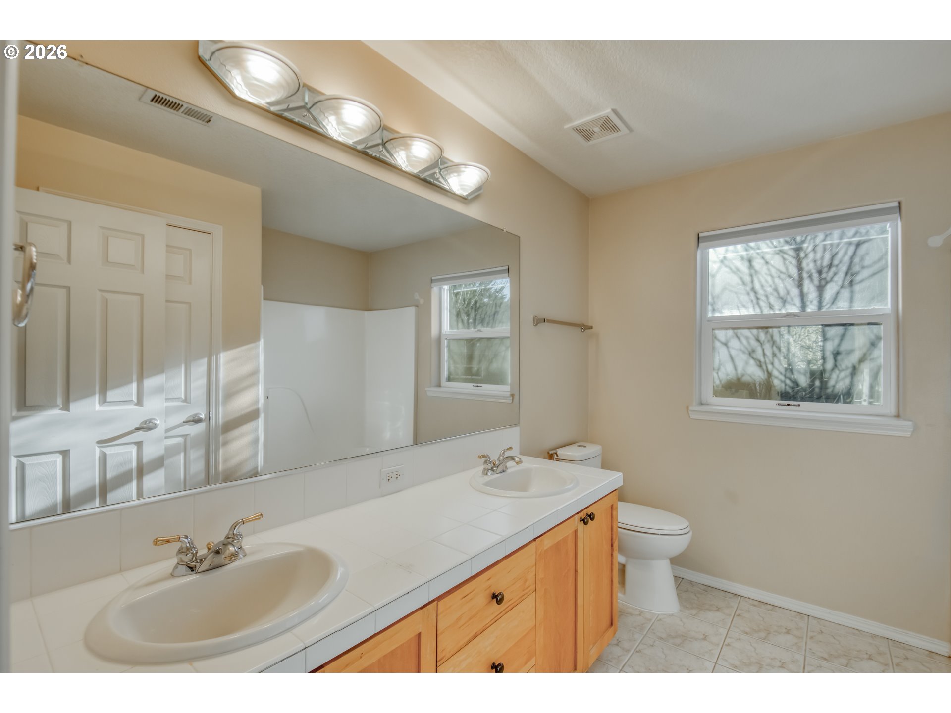 3637 Northwest Lansbrook Terrace Portland, OR 97229 - Photo 21 of 43 a bathroom with a granite countertop sink and a mirror