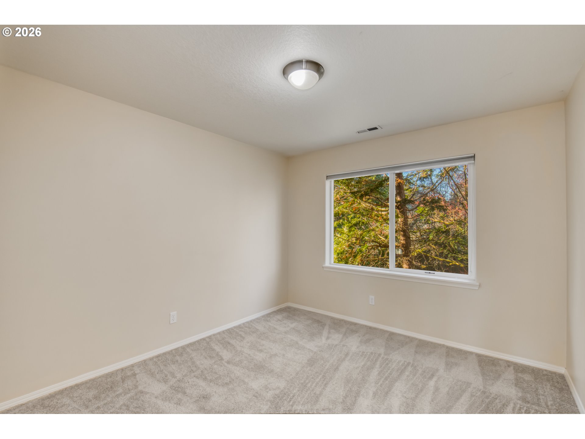 3637 Northwest Lansbrook Terrace Portland, OR 97229 - Photo 22 of 43 a view of an empty room with a window