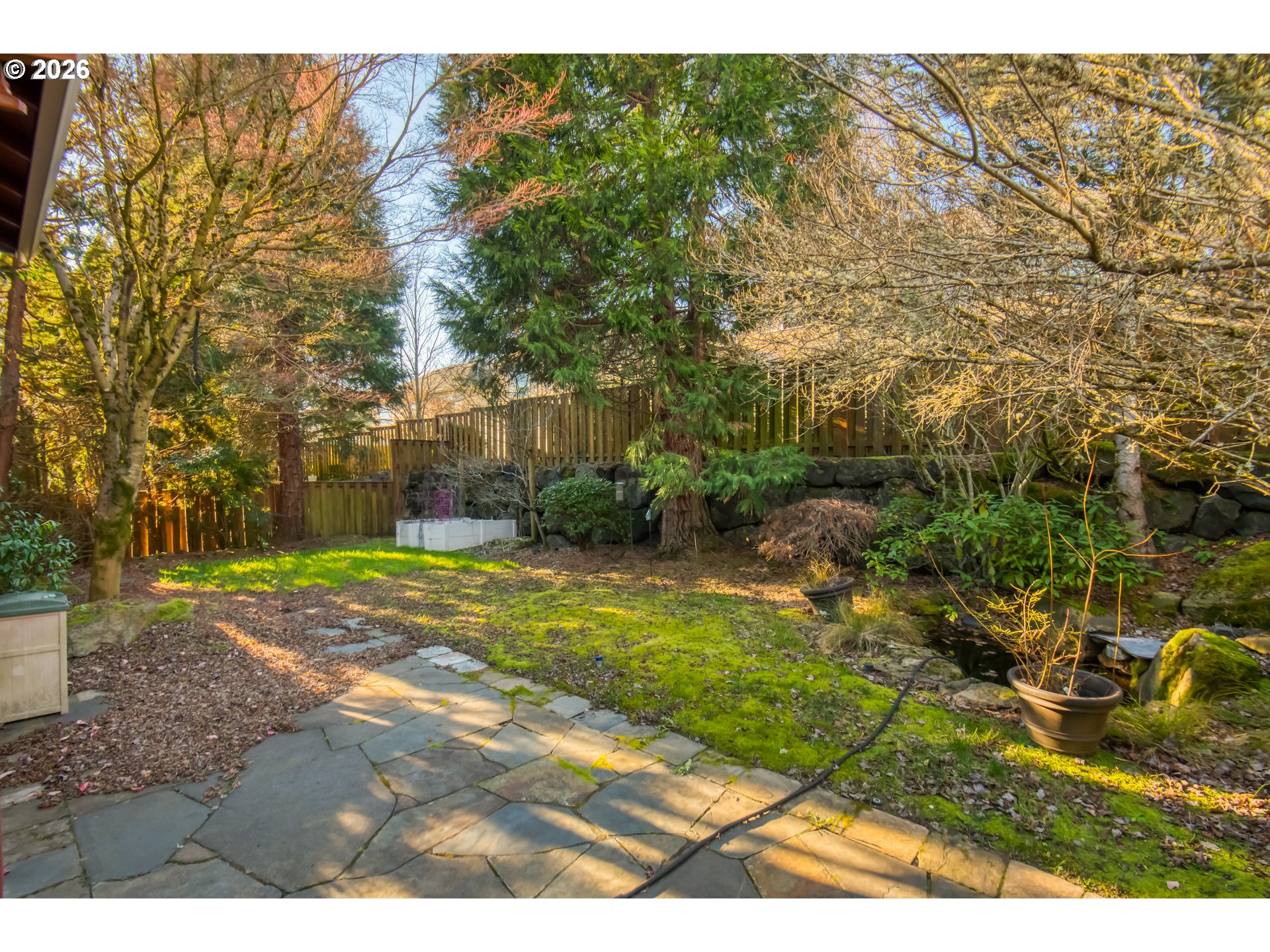 3637 Northwest Lansbrook Terrace Portland, OR 97229 - Photo 30 of 43 a view of a yard with plants and large trees