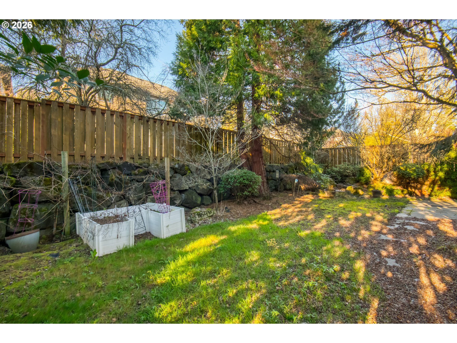 3637 Northwest Lansbrook Terrace Portland, OR 97229 - Photo 31 of 43 a backyard of a house with table and chairs