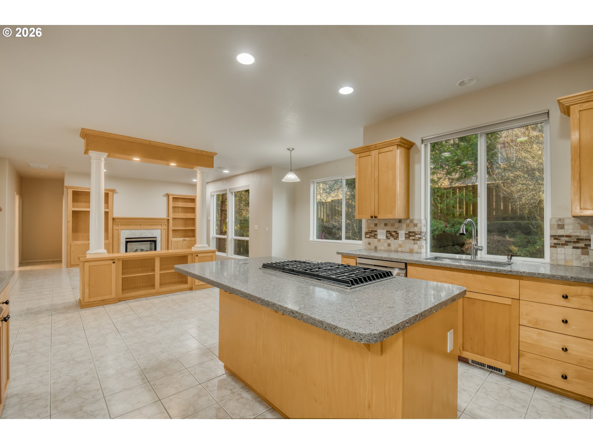 3637 Northwest Lansbrook Terrace Portland, OR 97229 - Photo 8 of 43 a kitchen with granite countertop a stove and a sink