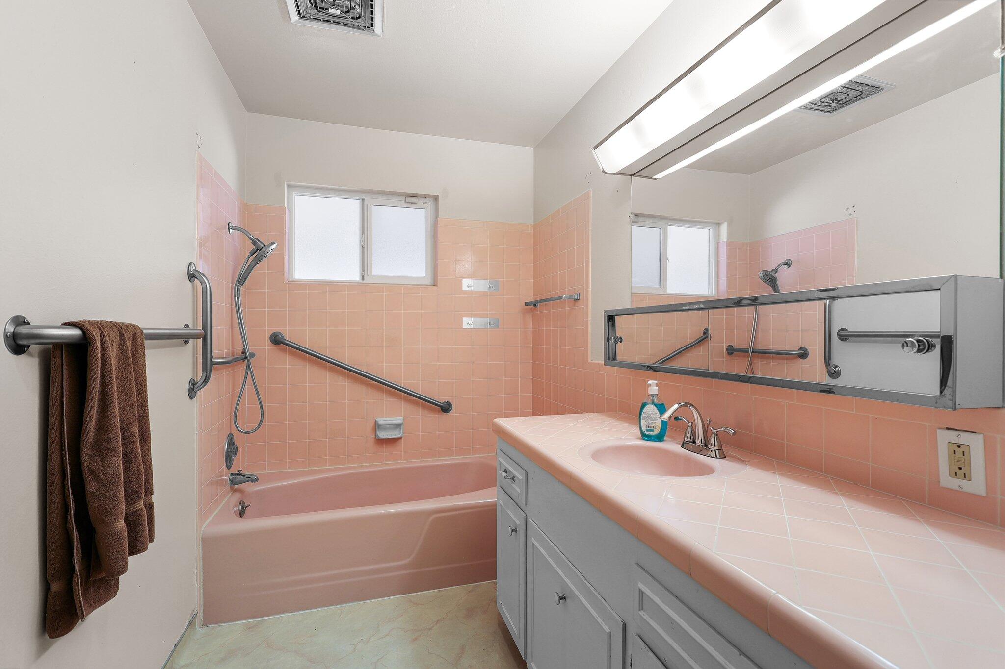 910 Hallmark Drive Redding, CA 96001 - Photo 14 of 40 a bathroom with a tub sink and mirror