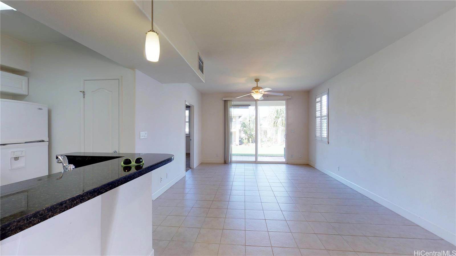 92-1033 Koio Drive, Unit M156 Kapolei, HI 96707 - Photo 19 of 20 a view of kitchen with windows and refrigerator