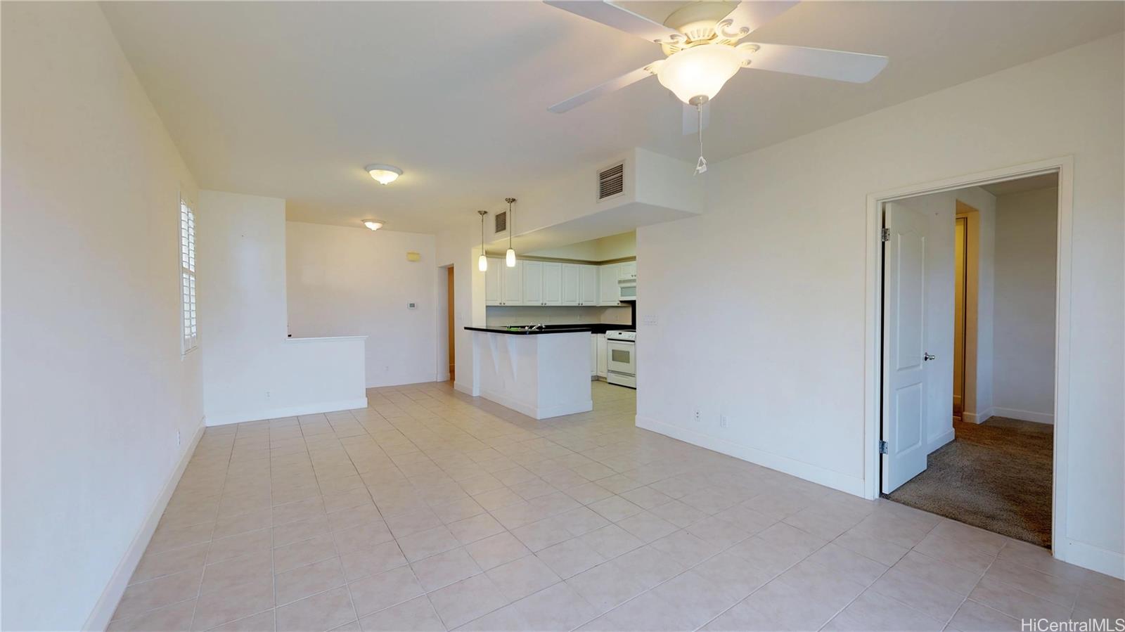 92-1033 Koio Drive, Unit M156 Kapolei, HI 96707 - Photo 20 of 20 a view of a kitchen with a sink and a ceiling fan