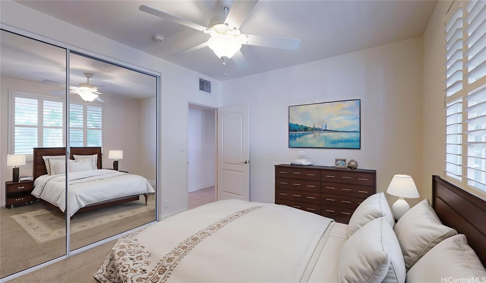 92-1033 Koio Drive, Unit M156 Kapolei, HI 96707 - Photo 2 of 20 a bedroom with a bed and a dresser