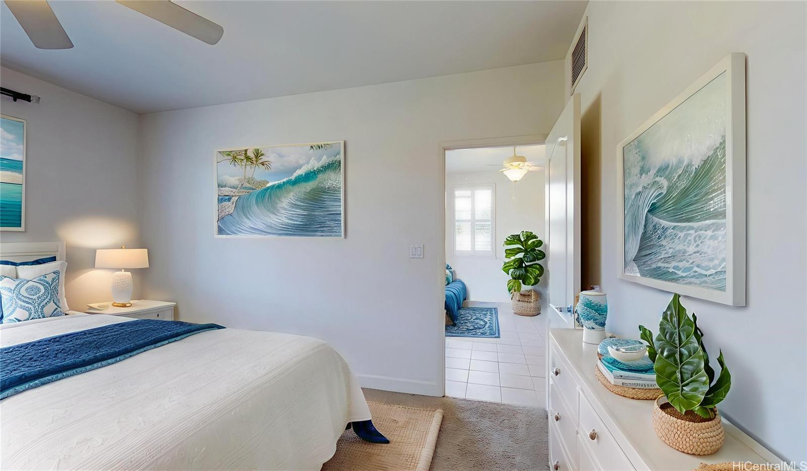 92-1033 Koio Drive, Unit M156 Kapolei, HI 96707 - Photo 4 of 20 a bedroom with a bed and potted plant