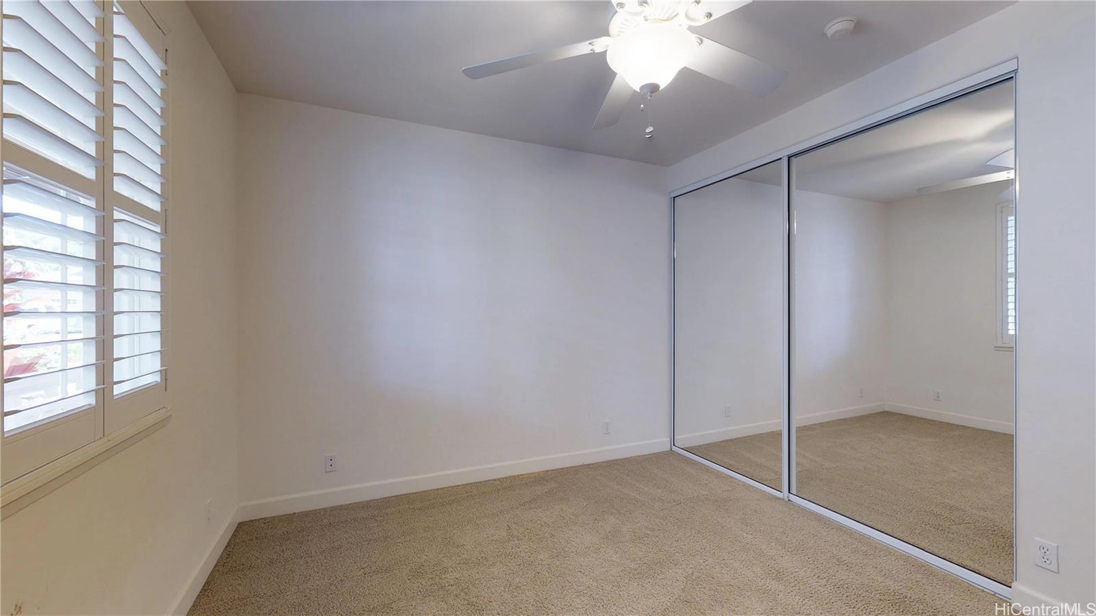 92-1033 Koio Drive, Unit M156 Kapolei, HI 96707 - Photo 6 of 20 a view of an empty room with a window
