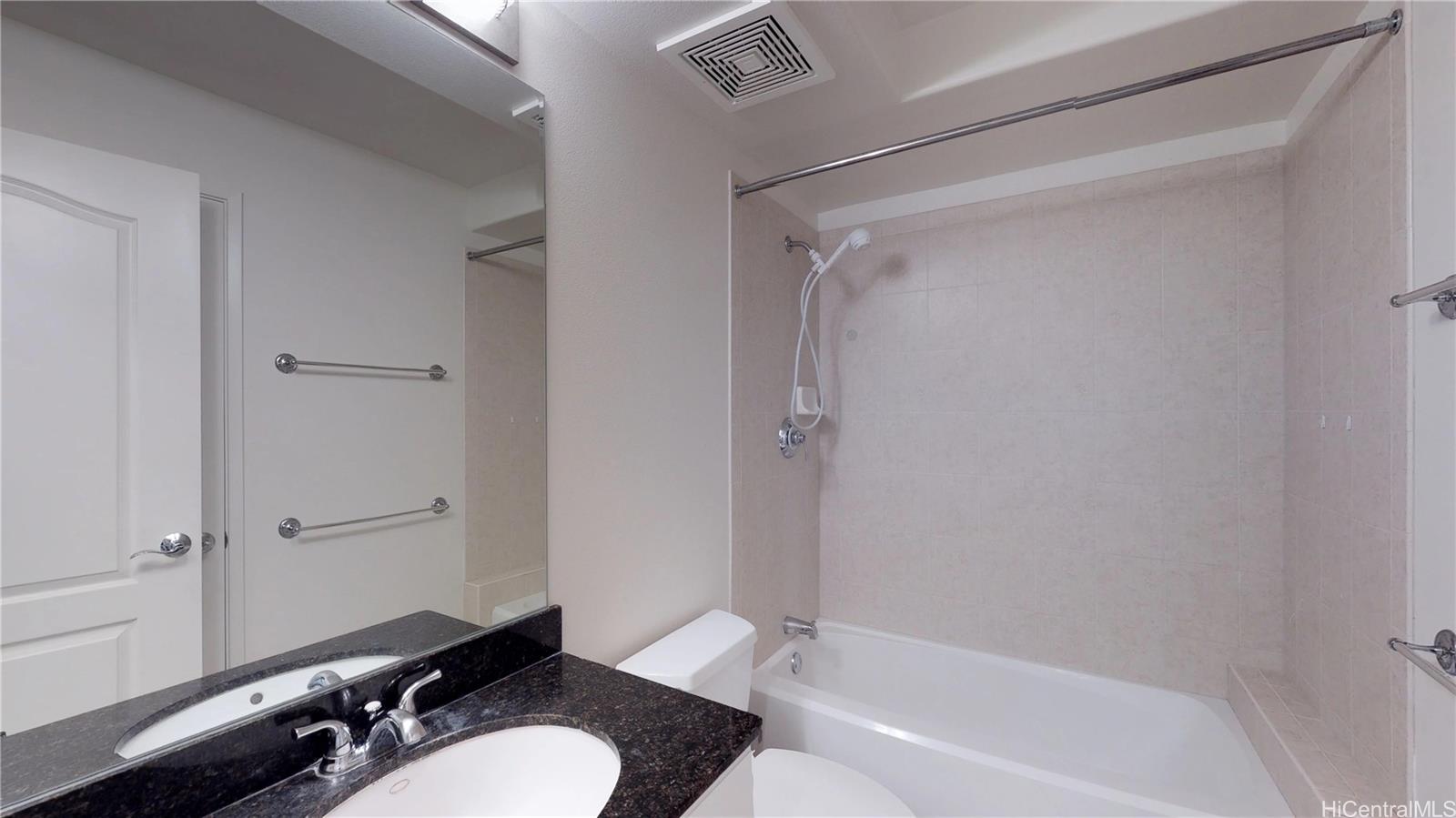 92-1033 Koio Drive, Unit M156 Kapolei, HI 96707 - Photo 10 of 20 a bathroom with a granite countertop bathtub shower sink vanity and toilet