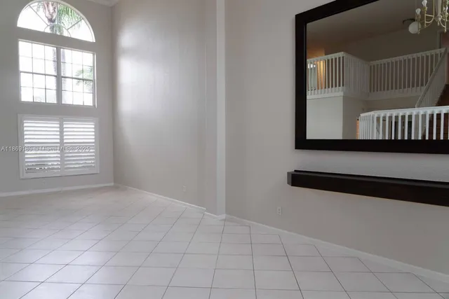 a kitchen with stainless steel appliances a stove refrigerator sink and microwave