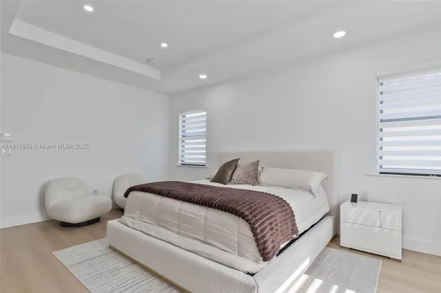 a bedroom with a bed and a couch