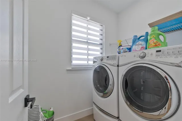 a utility room with dryer and washer