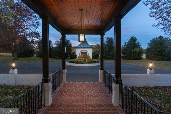 a view of a porch with wooden floor