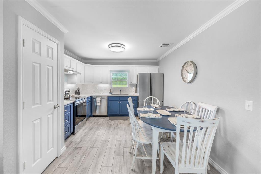 154 Wapiti Quitman, TX 75783 - Photo 11 of 31 a view of a dining room with furniture window and wooden floor