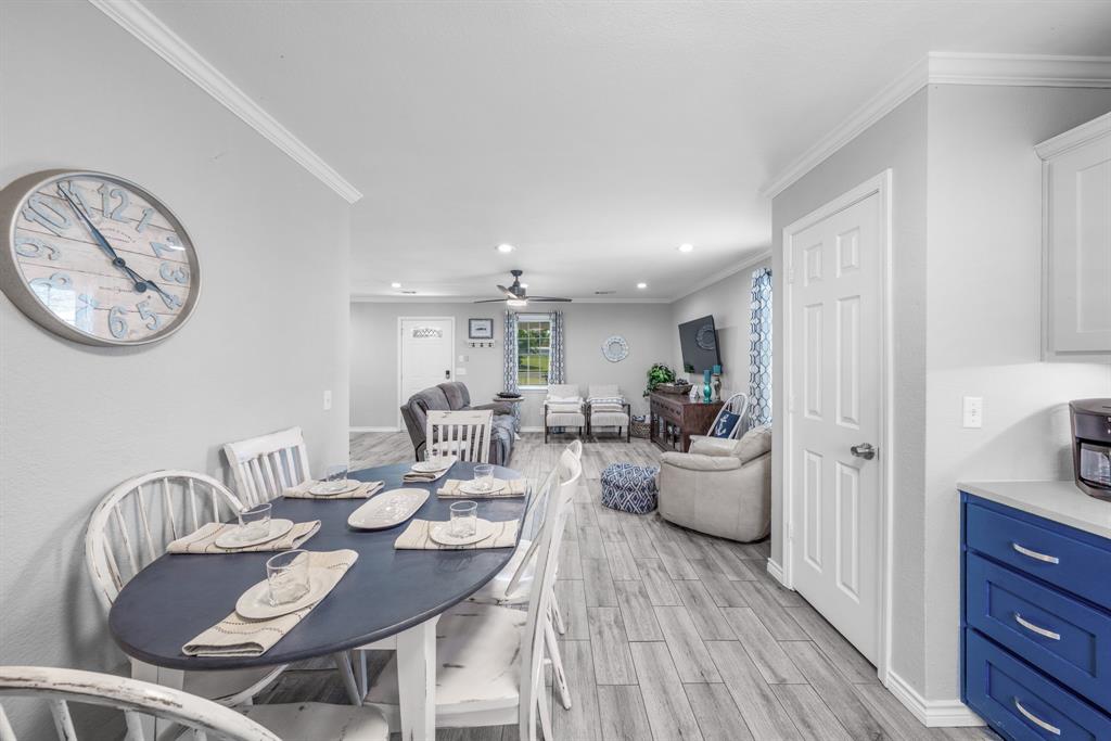 154 Wapiti Quitman, TX 75783 - Photo 14 of 31 a view of a dining room with furniture and wooden floor