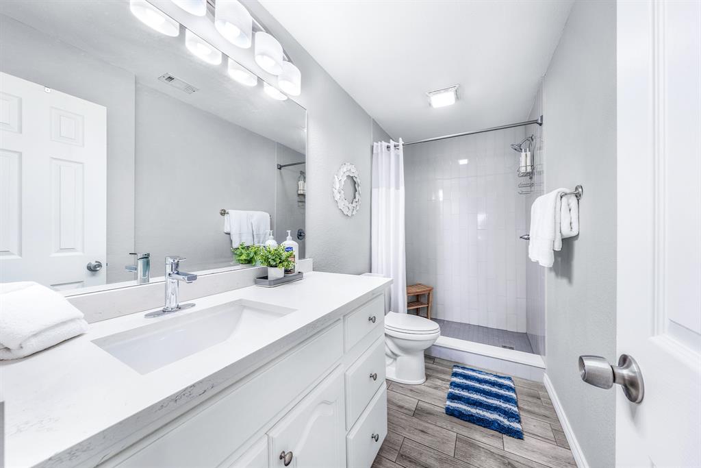 154 Wapiti Quitman, TX 75783 - Photo 18 of 31 a bathroom with a sink a toilet and shower