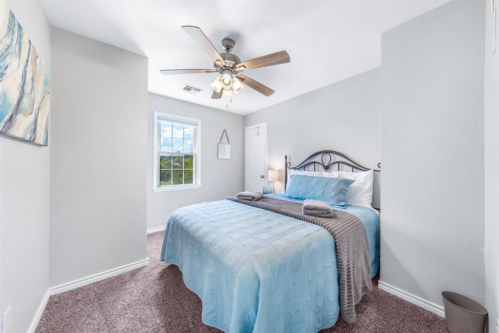 154 Wapiti Quitman, TX 75783 - Photo 22 of 31 a bedroom with a bed and a window