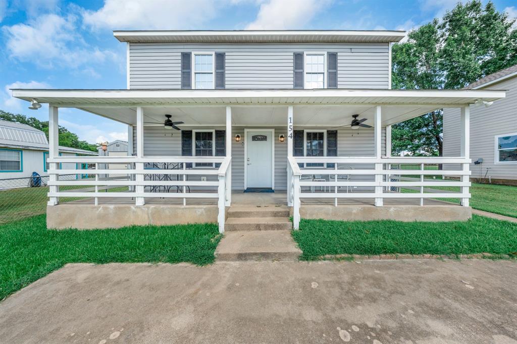 154 Wapiti Quitman, TX 75783 - Photo 5 of 31 a front view of a house with a yard and garage