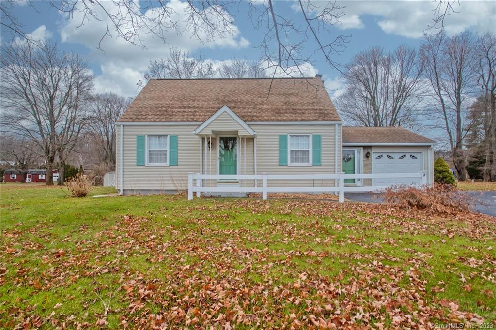2 Egypt Road Ellington, CT 06029 - Photo 1 of 1 a front view of house with yard and trees in the background