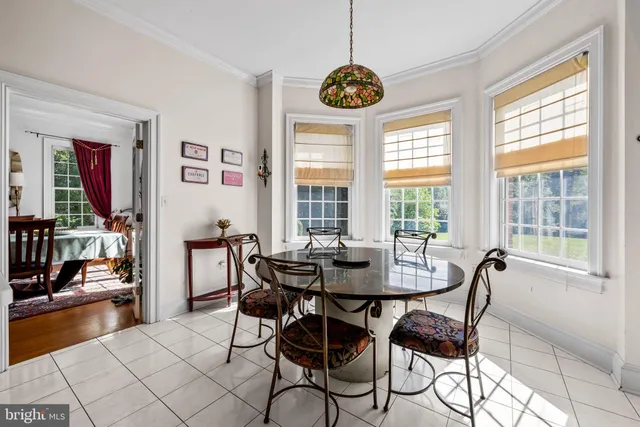 a living room with dining table