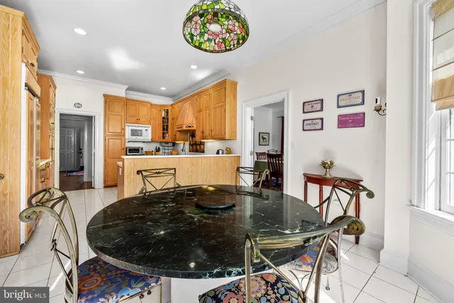 a kitchen with stainless steel appliances a stove sink and cabinets