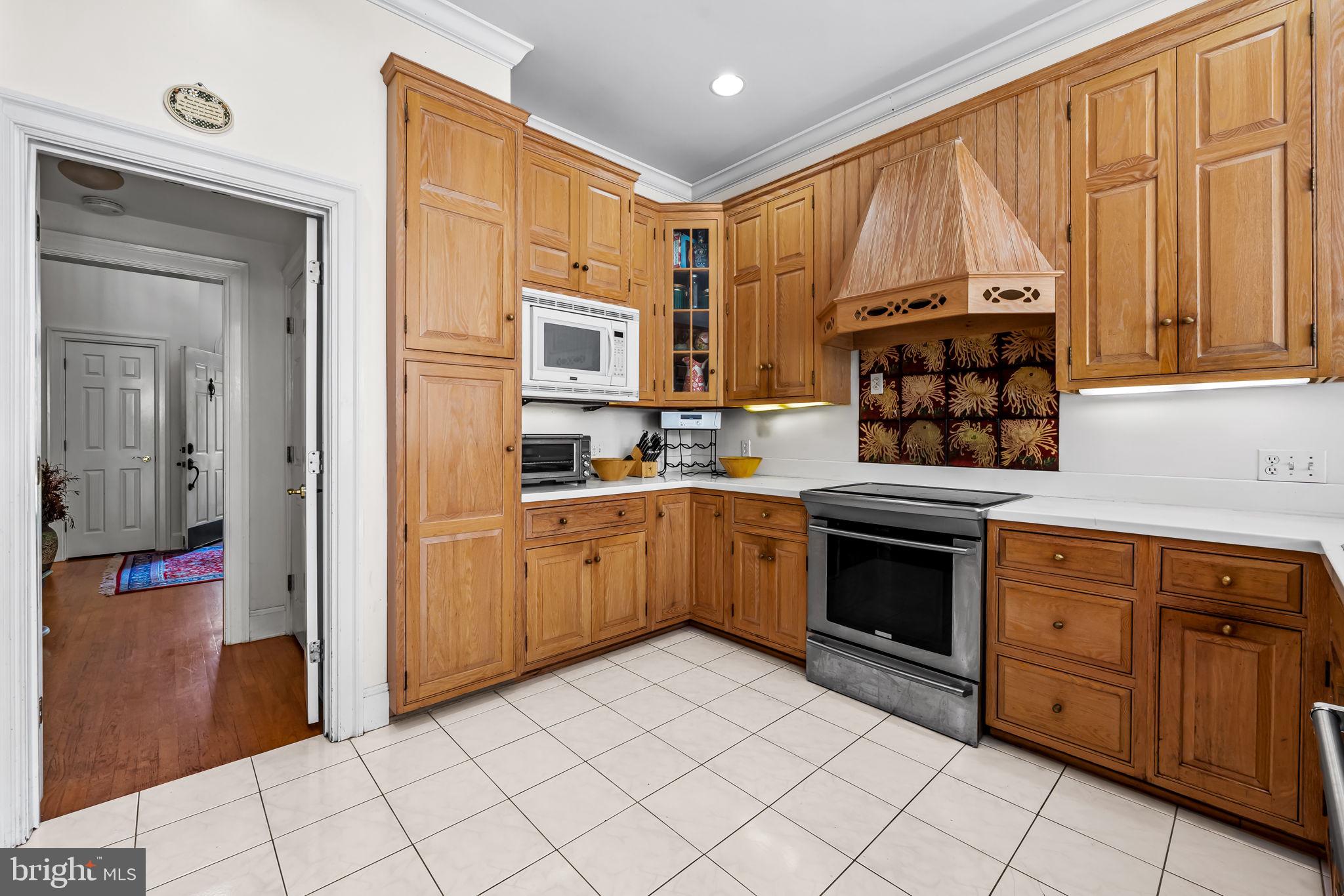 660 Greenbridge Road Brookeville, MD 20833 - Photo 15 of 56 a kitchen with stainless steel appliances a stove sink and cabinets
