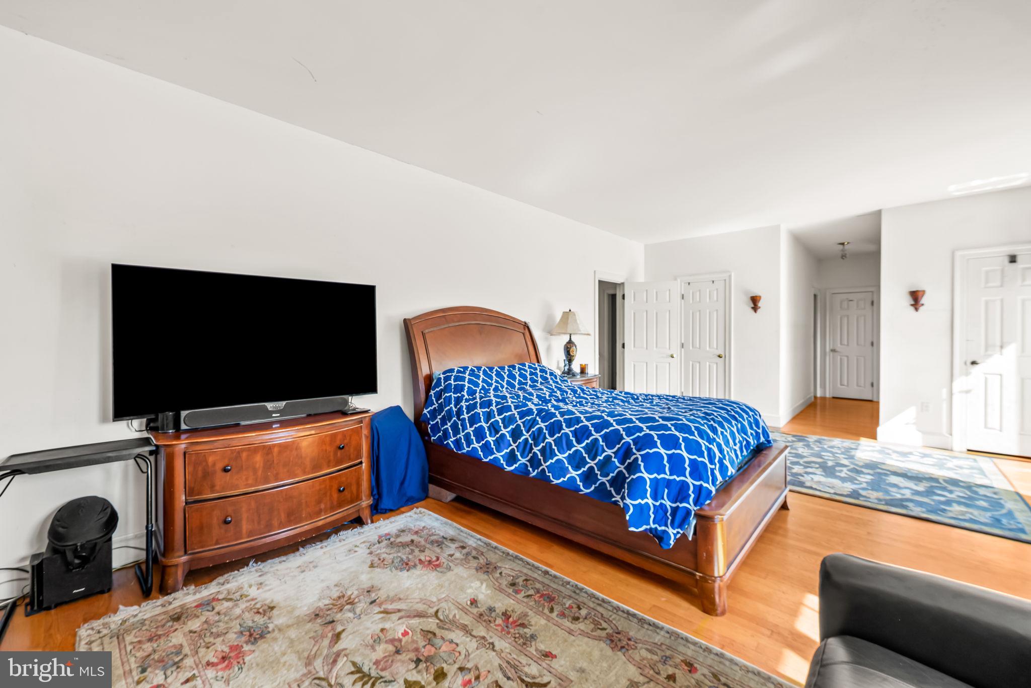 660 Greenbridge Road Brookeville, MD 20833 - Photo 23 of 56 a bedroom with a bed and flat screen tv