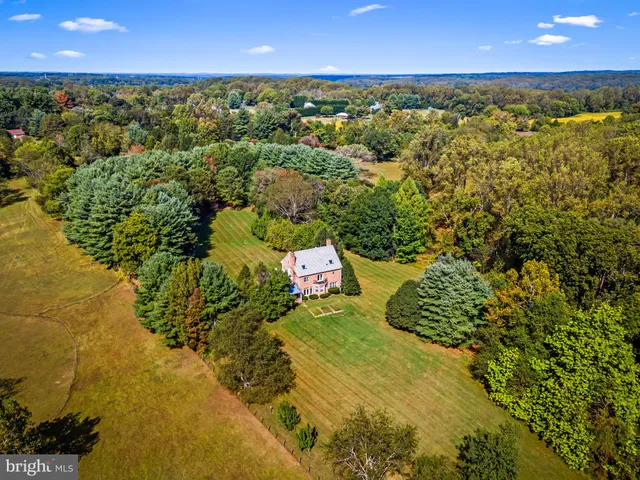 a view of a lake with houses in the background
