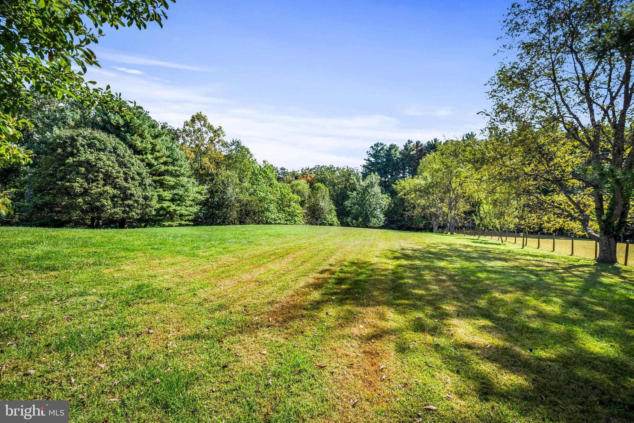 660 Greenbridge Road Brookeville, MD 20833 - Photo 32 of 56 a view of green field with trees in the background