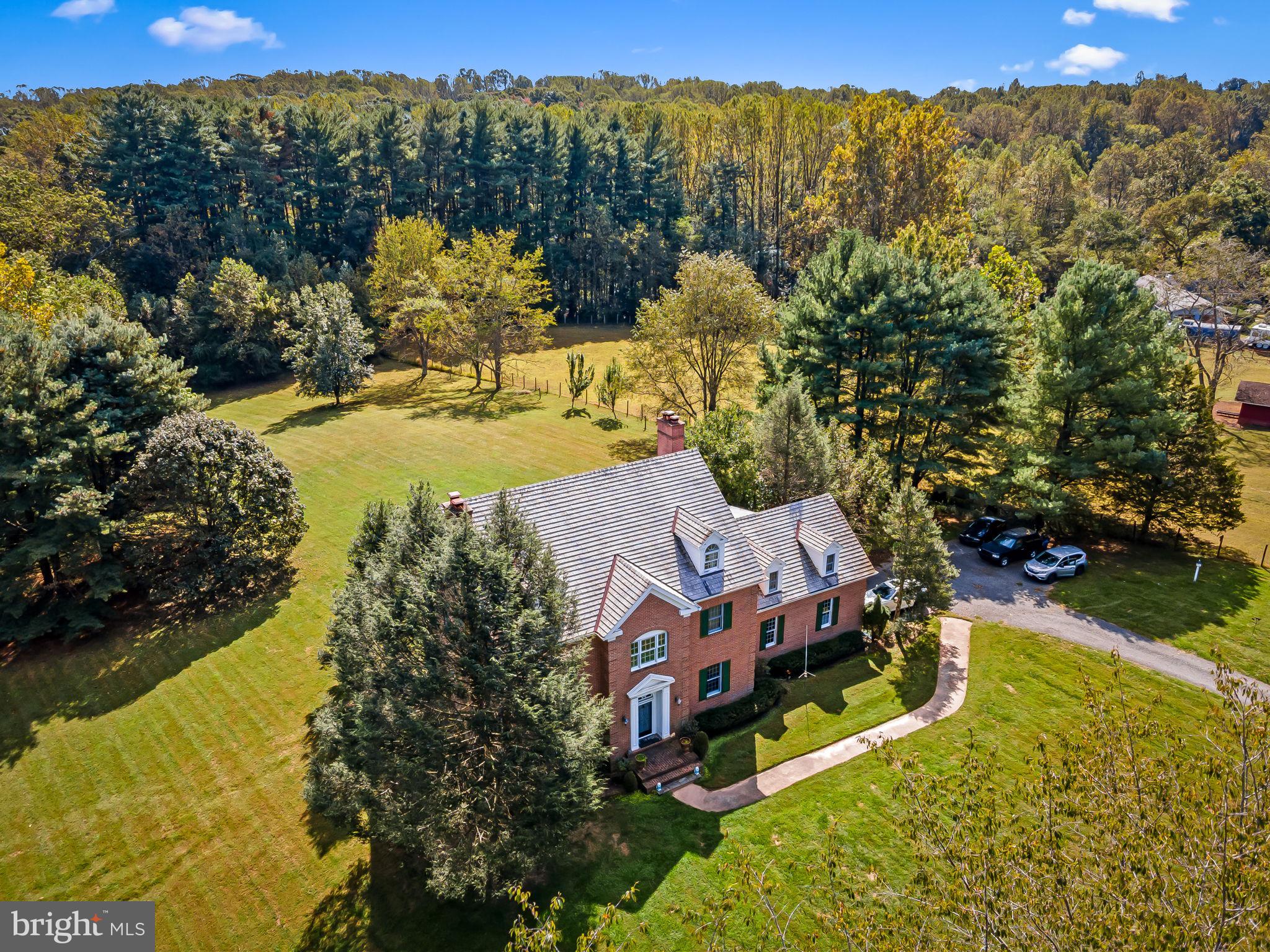 660 Greenbridge Road Brookeville, MD 20833 - Photo 39 of 56 a view of a house with a yard and a large pool