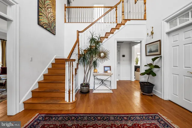 a view of an entryway with wooden floor