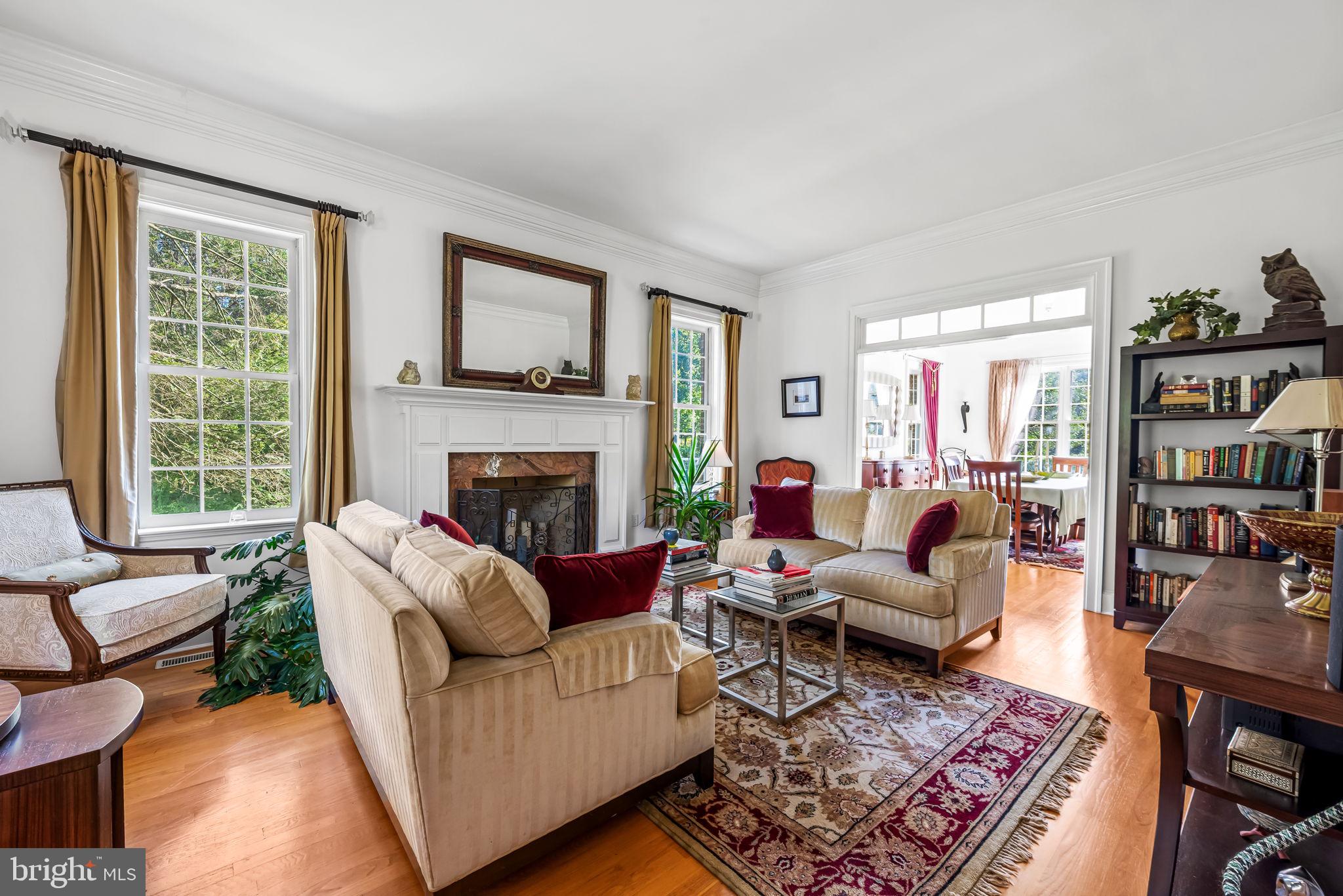 660 Greenbridge Road Brookeville, MD 20833 - Photo 9 of 56 a living room with furniture and a fireplace