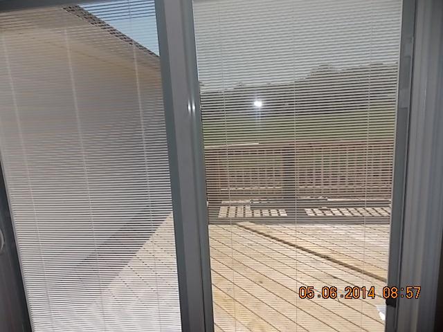 505 Old Hunters Point Pike Lebanon, TN 37087 - Photo 13 of 14 Combination Dining Room area off kitchen with Built in-door blinds to back deck.
